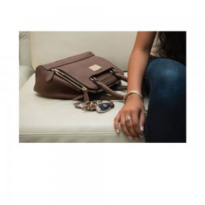 This concealed carry purse features ambidextrous access with a zippered three-sided pocket located on the front of the bag.