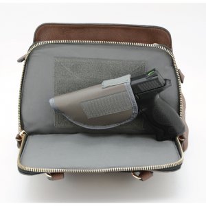 This concealed carry purse features ambidextrous access with a zippered three-sided pocket located on the front of the bag.