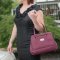 This concealed carry purse features ambidextrous access with a zippered three-sided pocket located on the front of the bag.